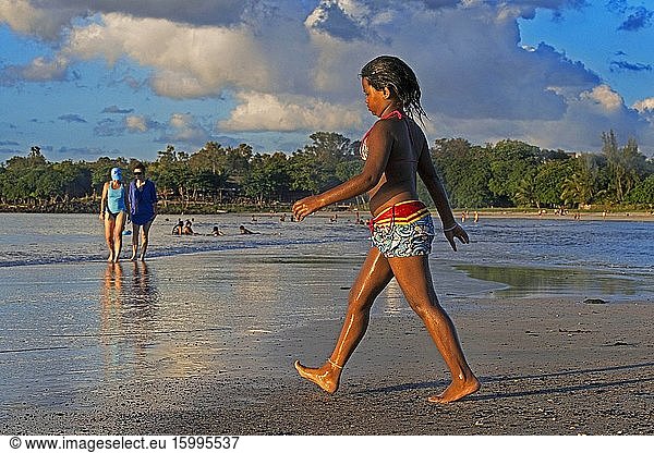 Walking in Tamarin beach  Mauritius. Relection in the water.