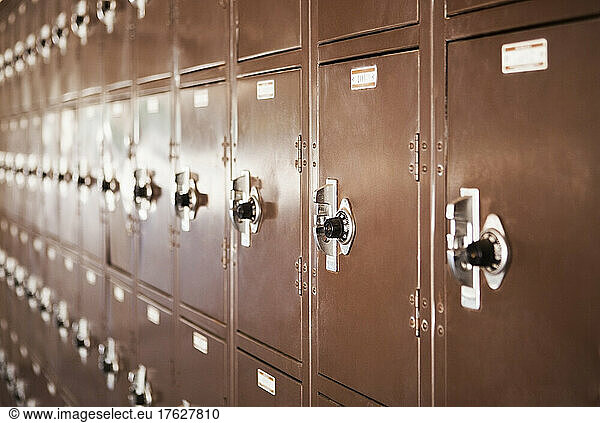 Wall of high school lockers in rows.