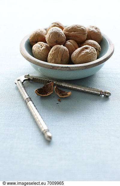 Walnuts in Bowl with Nut Cracker