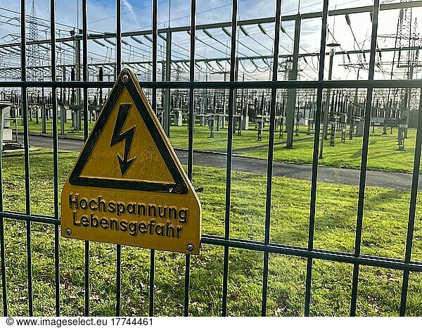 Warning sign High voltage Danger to life on safety fence of power supply substation  North Rhine-Westphalia  Germany  Europe