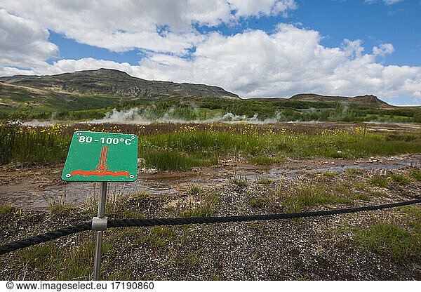 warning signs at the Geysir hot spring area in Iceland