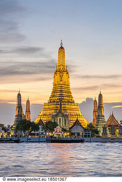 Wat Arun temple in Bangkok illuminated at sunset