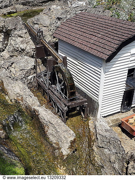 Water mill for grinding corn from the Bekonscot Model Village in Beaconsfield Buckinghamshire England