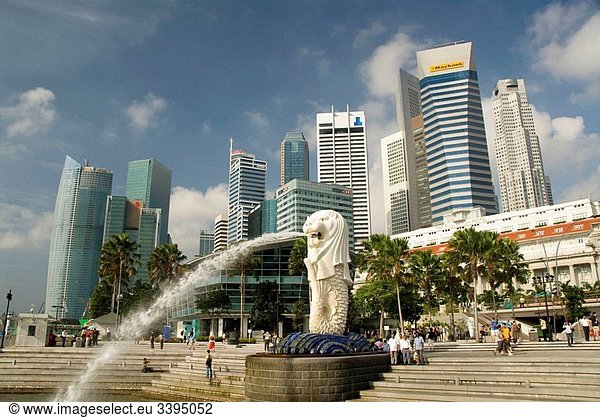 Water spray from Merlion (foreground) with city skyline in background  Singapore