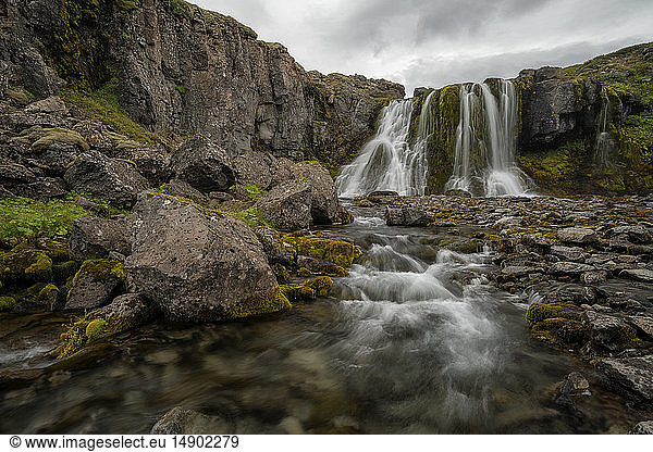 Waterfall along the road on the West Fjords; West Fjords  Iceland