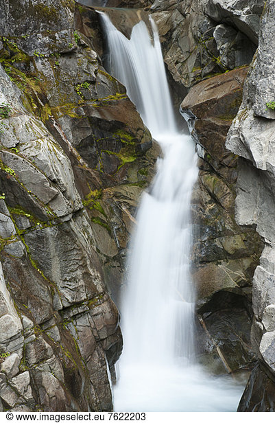 Waterfall on rocky hillside
