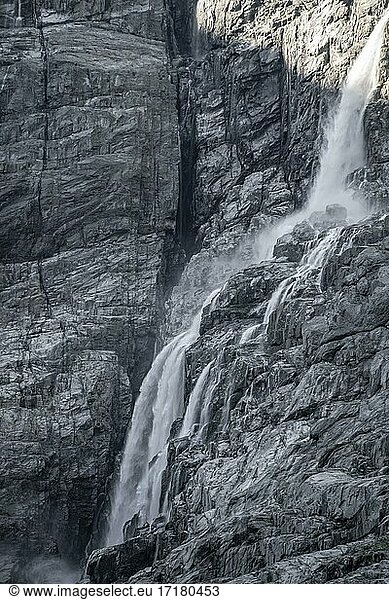 Waterfall on steep cliff  Kjenndalsbreen glacier  Loen  Vestland  Norway  Europe
