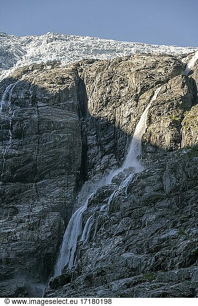 Waterfalls on steep cliff  Kjenndalsbreen glacier  Loen  Vestland  Norway  Europe