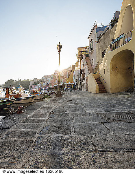 Waterfront restaurants and harbour boats at Procida island,  Campania,  Italy