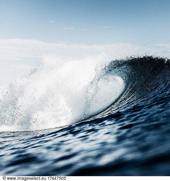 wave breaking on the sea surface  tube  aggressive  blue