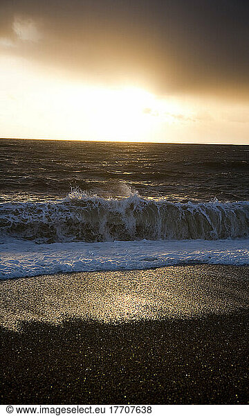 Waves Rolling Into The Shore At Sunset  Chesil Beach; Dorset  England