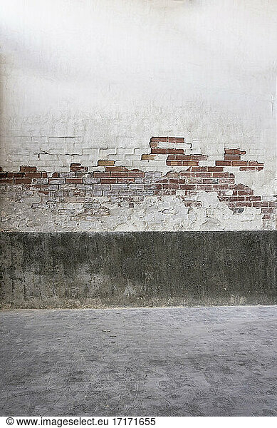 Weathered brick wall in abandoned factory