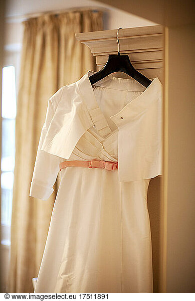 Wedding dress hanging on coathanger