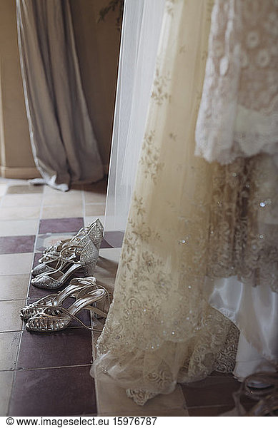 Wedding dresses and shoes on the floor