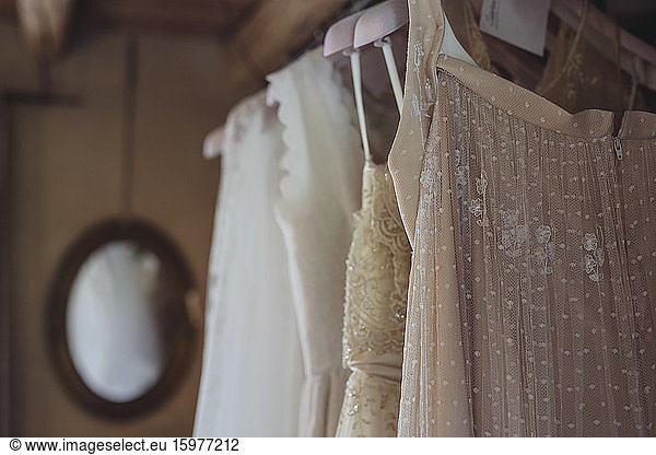 Wedding dresses hanging on coathanger