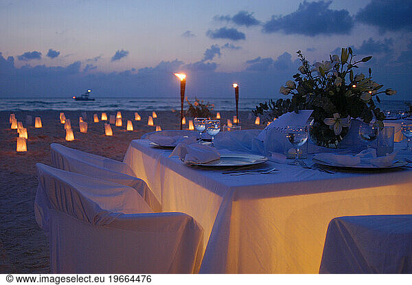 Wedding reception tables with candlelight on Isla Mujeres  Mexico