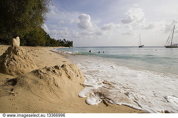WEST INDIES Barbados St Peter Gibbes Bay beach in the late afternoon with sandcastles at the waters edge