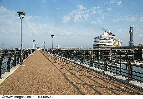 Western Docks  Dover  Kent  England  The new pier a part of the revival project within the Western Docks area  Dover. In background the cruise ship Disney Magic alongside.