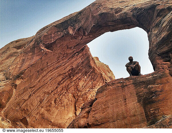 Whit Richardson Sits Beneath Funnel Arch Moab Utah Whit Richardson Sits