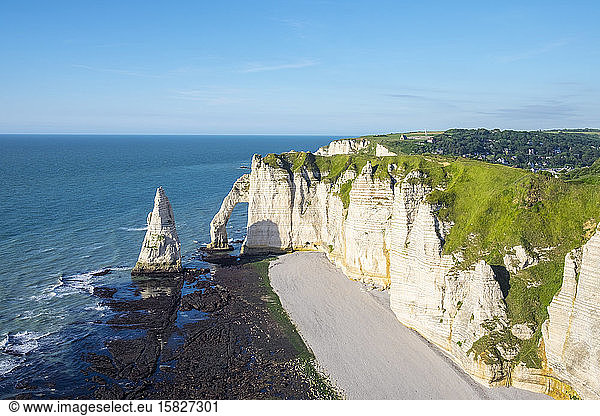White chalk cliffs and Aiguille d'Etretat  natural stone arch on the English Channel  Etretat  Seine-Maritime department  Normandy  France
