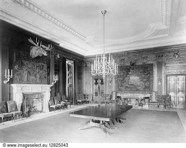 WHITE HOUSE  1902. A room within the White House during the administration of Theodore Roosevelt  featuring a fireplace  mounted moose head  and chandelier. Photograph by John F. Jarvis  1902.