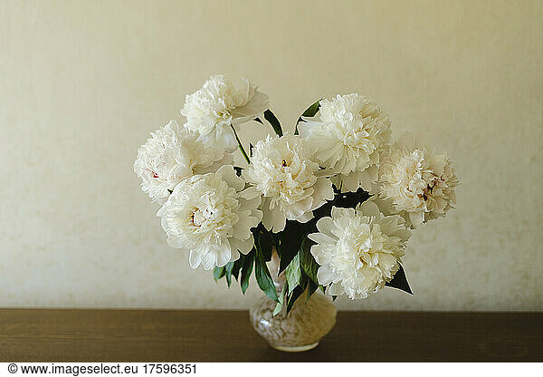 White peonies in vase at home