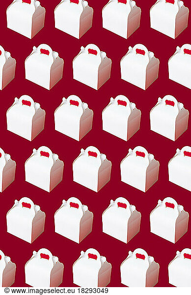 White take away boxes arranged on red background