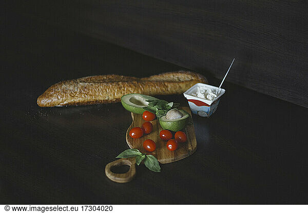 Wide angle of bread tomato avocado curd cheese to prepare toast