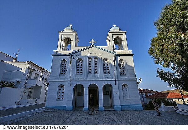 Wide angle shot  blue and white church  front  penumbra  blue cloudless sky  Chora  Andros Town  Andros Island  Cyclades  Greece  Europe