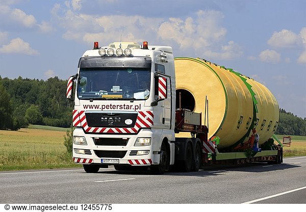 Wide load transport of a silo by MAN TGX 26. 540 semi trailer of Peter-Star  Poland on the road in South of Finland. Salo  Finland - July 27  2018.