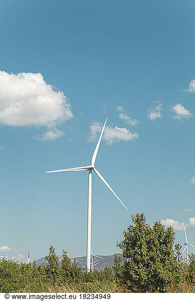 Wind turbine in front of blue sky