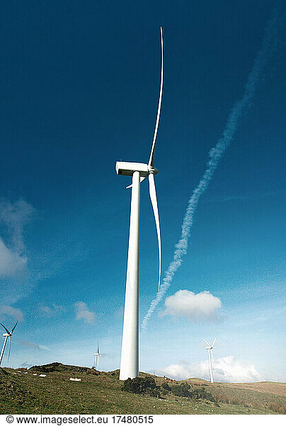 Wind turbines against blue sky