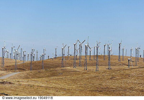 Wind turbines and hills.