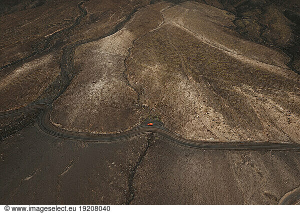 Winding road on volcanic landscape at Fuerteventura