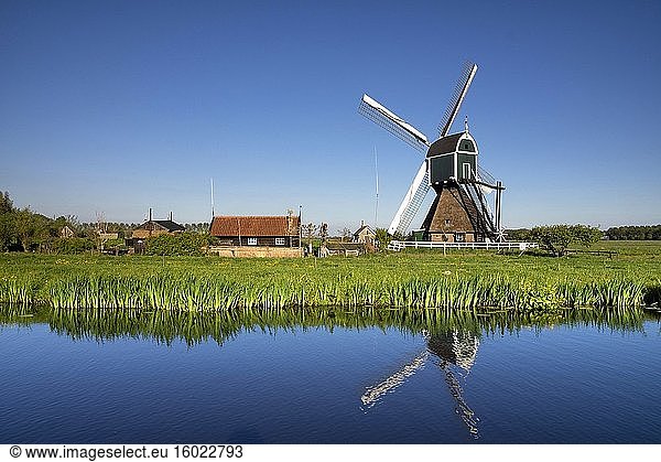 Windmill the Wingerdse Molen close to the Dutch village Bleskensgraaf seen on a clear and crisp day in spring.