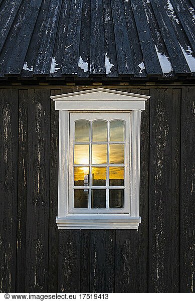window at the famous black wooden church at Budir in West Iceland