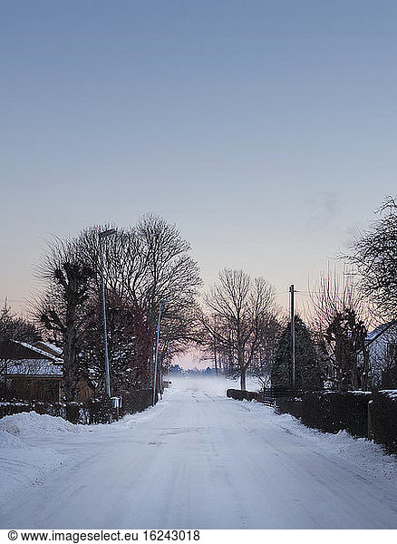 Winter road at sunset