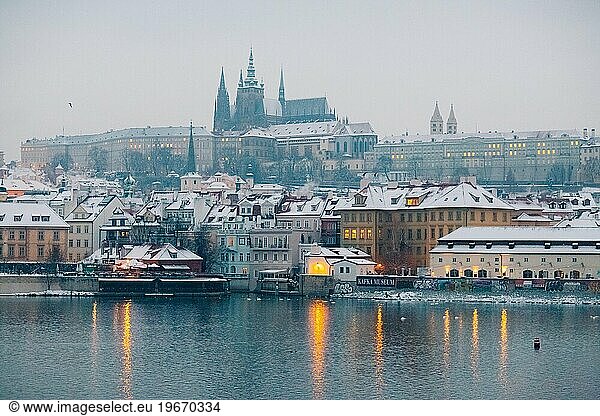 Winter twilight in Prague  snow  no one  lights on  Prague castle