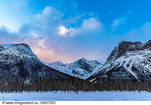 Winter wilderness sunset hiking in the snowy Canadian Rockies.