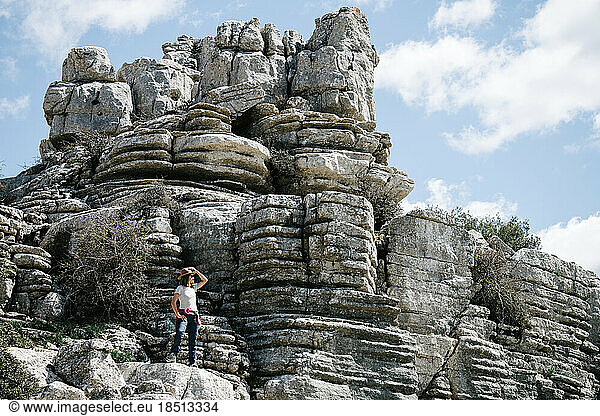 Woman admiring a unique limestone landscape.