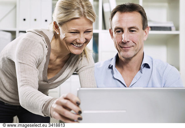 Woman and man with laptop