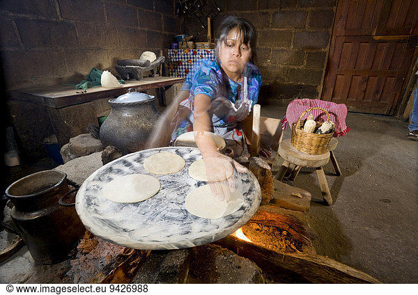 Woman baking tortillas  Zinacantán  Chiapas  Mexico