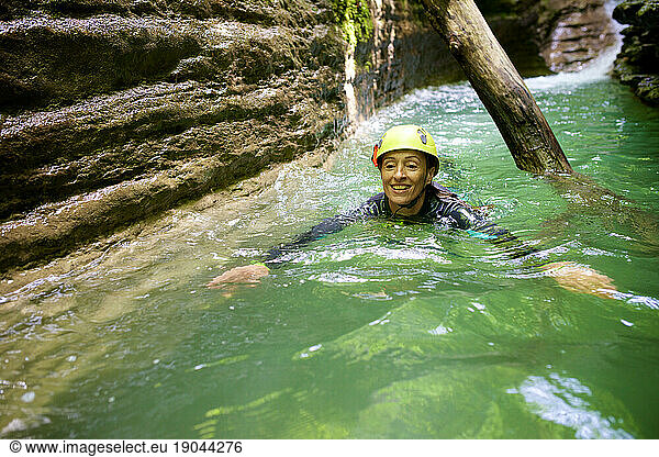 Woman canyoneering in Furco Canyon in Spanish Pyrenees