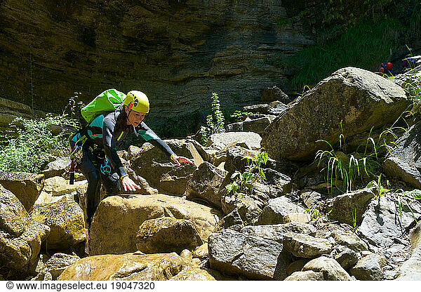 Woman canyoneering in Furco Canyon in Spanish Pyrenees