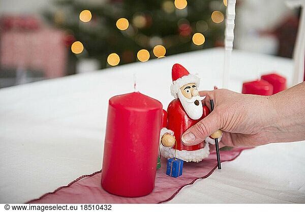 Woman decorating Christmas table