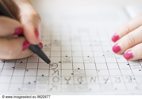 Woman doing crossword puzzle