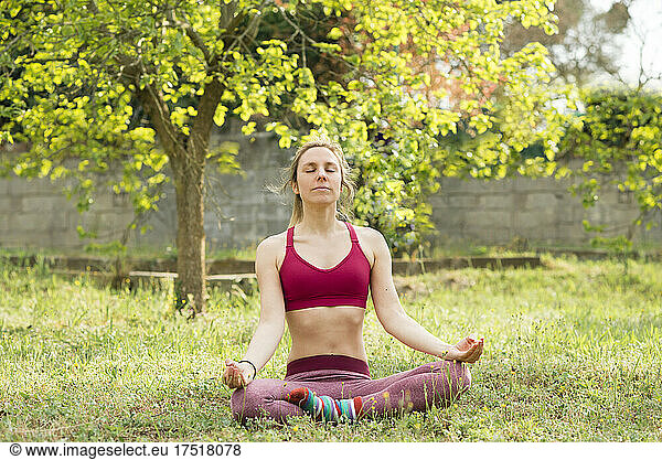 woman doing meditation in nature