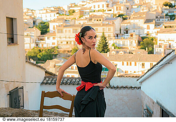 Woman dressed as a flamenco dancer in a street in Cazorla  Spain