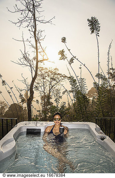 woman enjoying a bath in a hot tub in the Sri Lankan highlands