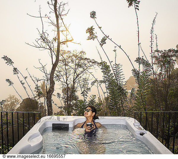 woman enjoying a bath in a hot tub in the Sri Lankan highlands
